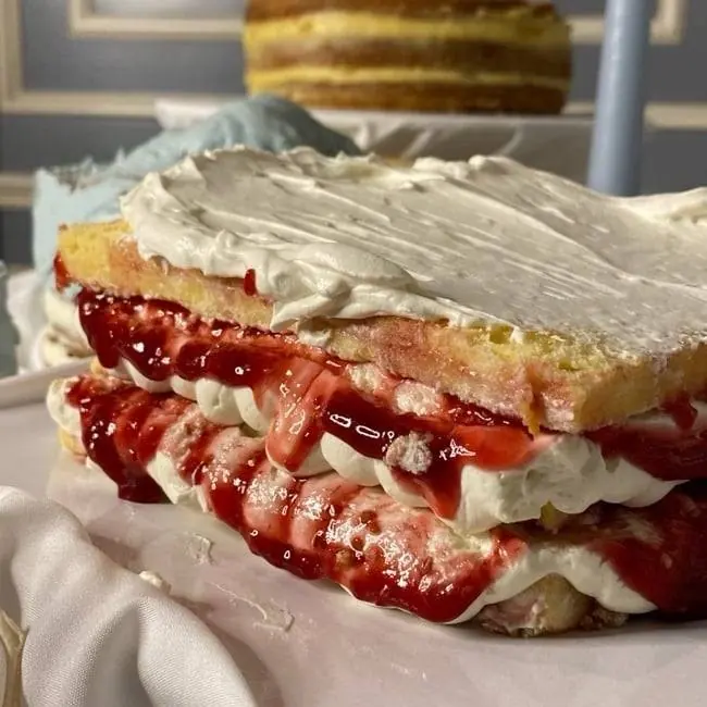 A slice of strawberry cream cake