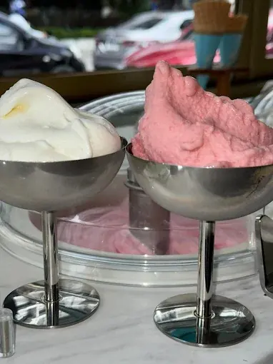 Two scoops of gelato in silver cups